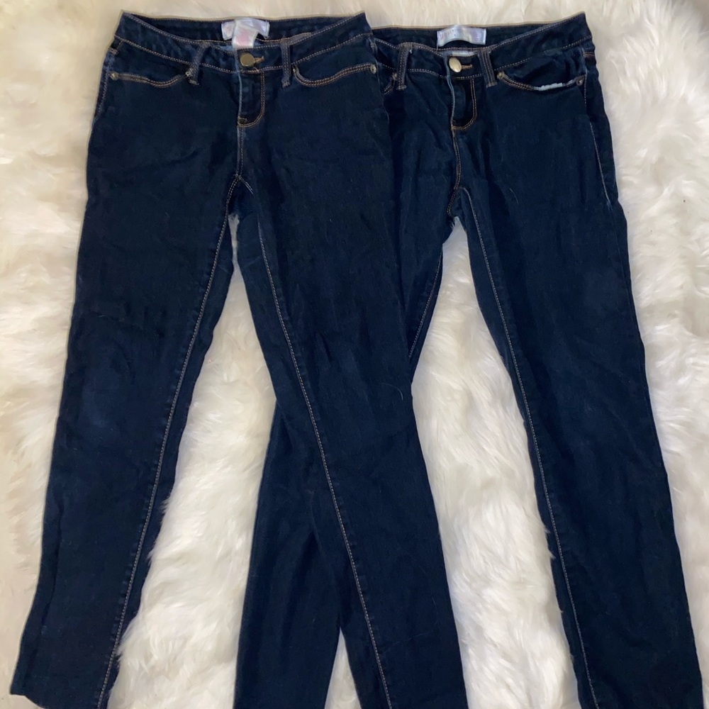 Two pairs of dark blue jeans